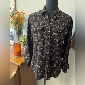 Cute button down animal pattern blouse.